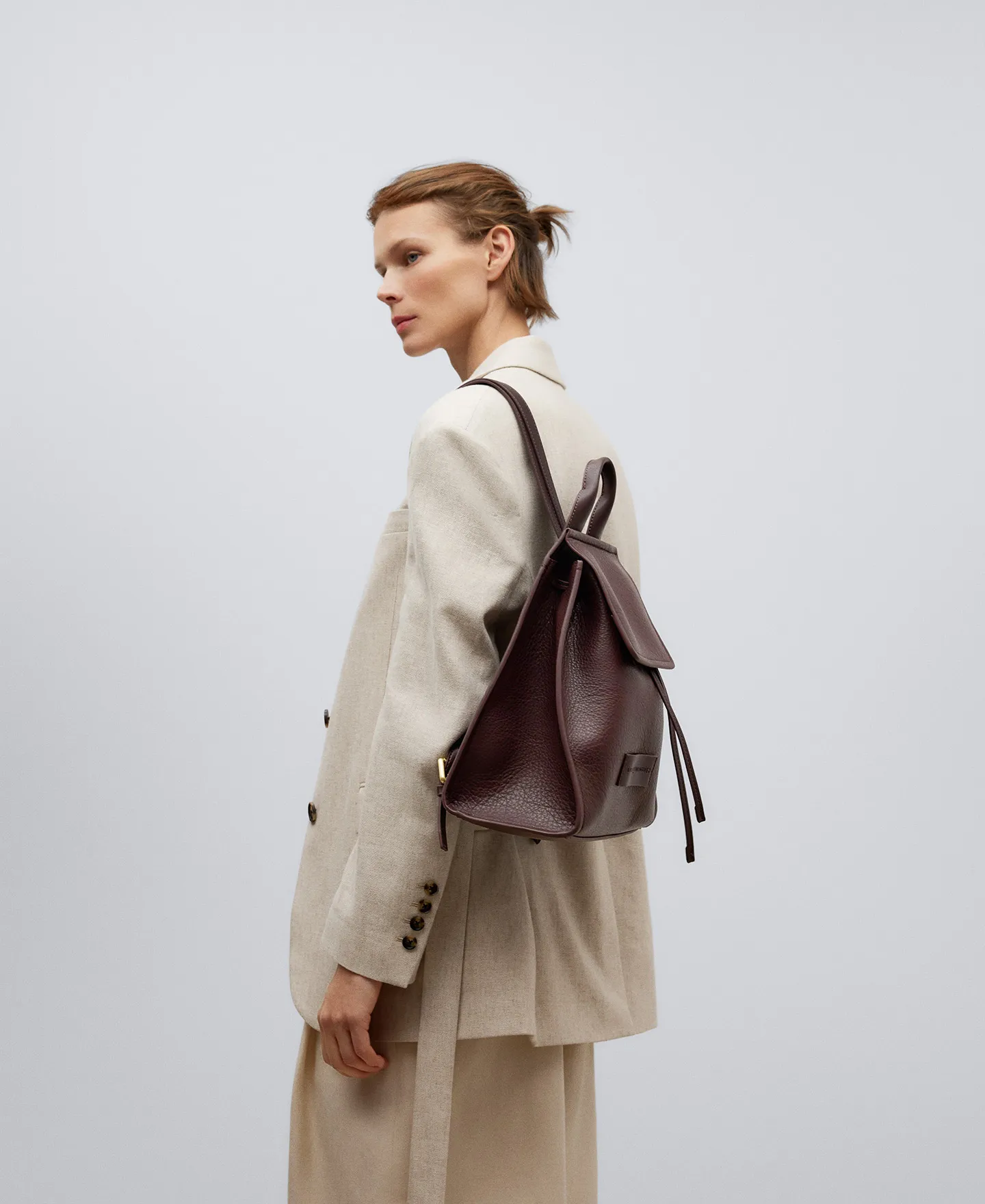 Brown recycled material backpack woman